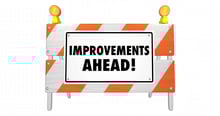 improvements-ahead-road-construction-sign-barrier